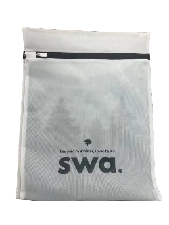 White pouch with 'swa.' branding on a wooden surface