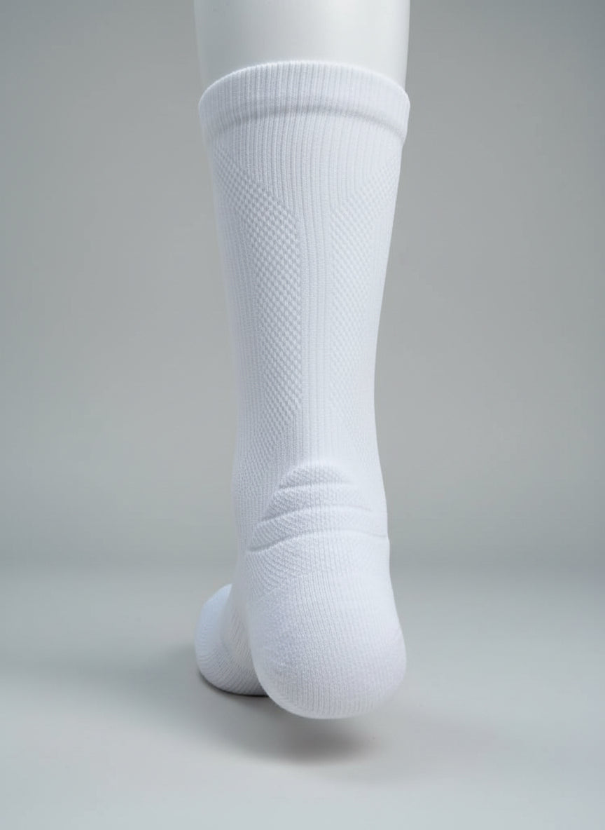 White knee-high socks on a light gray background