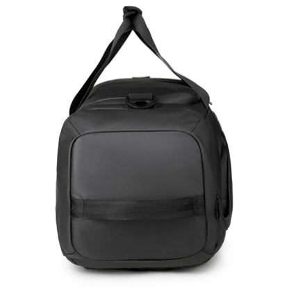 Black duffel bag with a shoulder strap on a white background